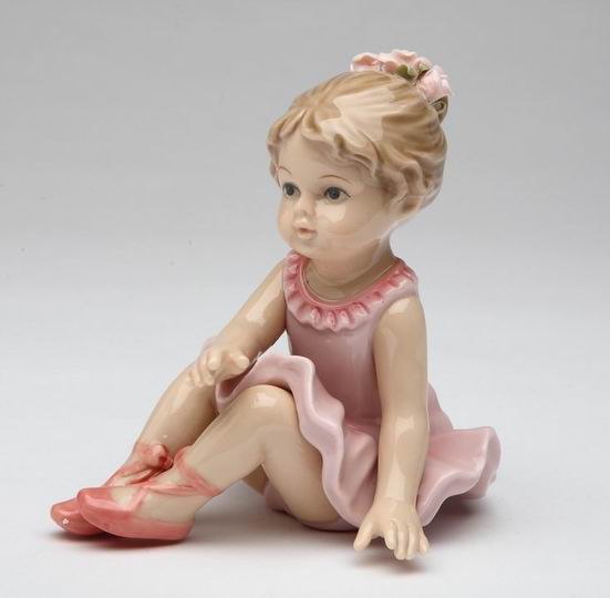 Porcelain Ballerina with Ballet Slippers Warming Up Figurine